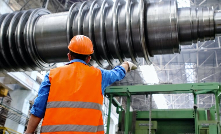 technician wearing orange hard hat
