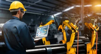 Technician working with robotic arm